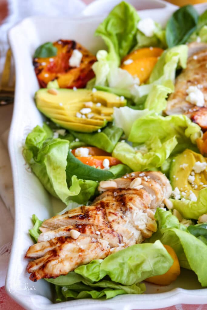 close up of grilled peach avocado chicken salad 