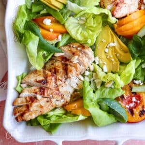 square image of grilled peach avocado chicken salad