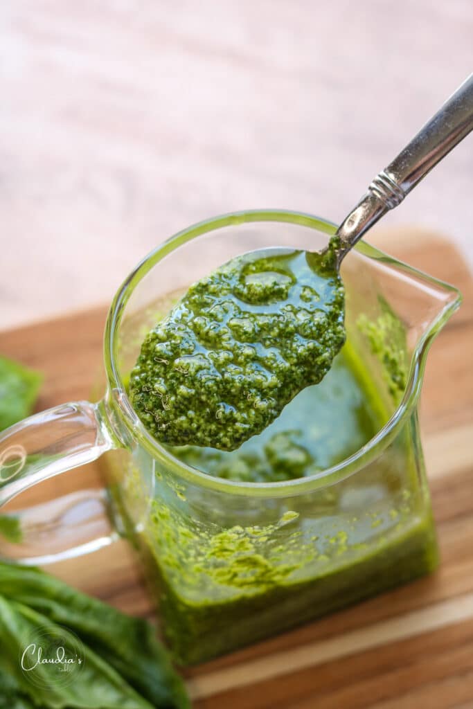 basil pesto vinagrette recipe. made with fresh basil in a clear glass container